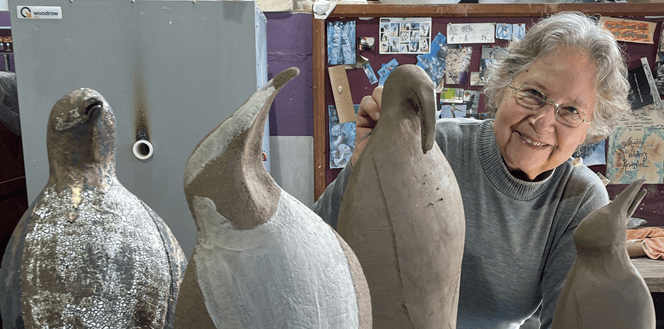 Aimee poses with pots